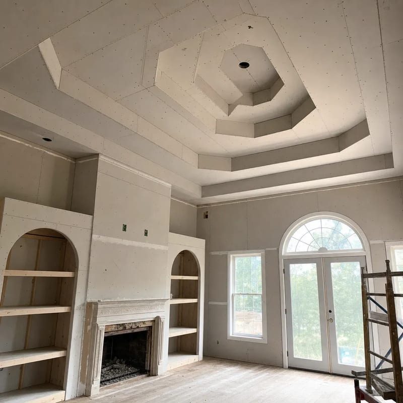 Before: raw drywall on a coffered ceiling in a new construction home